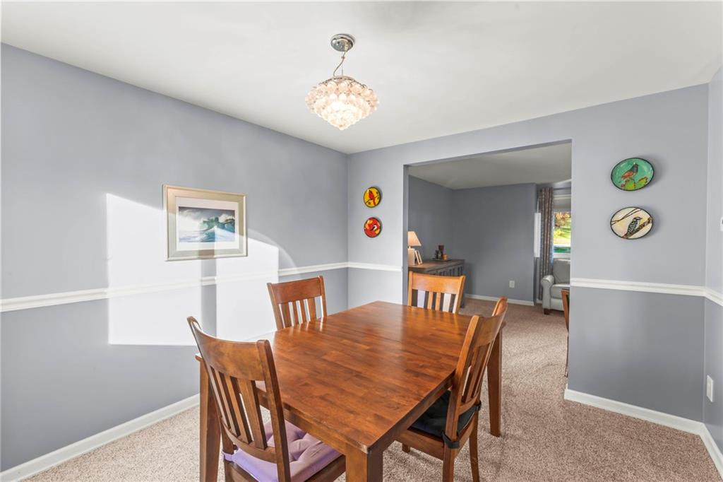 1256 Manor Drive Pittsburgh, PA 15241 - Photo 7 of 35 a view of a dining room with furniture and chandelier