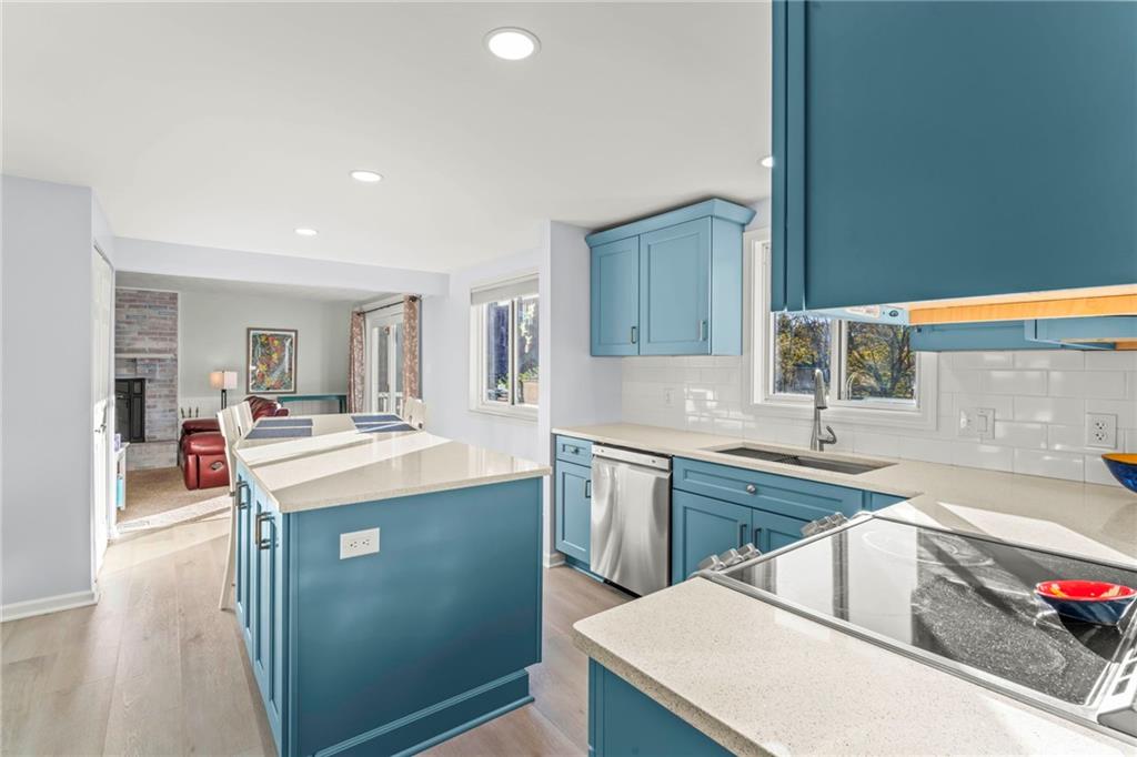 1256 Manor Drive Pittsburgh, PA 15241 - Photo 9 of 35 a kitchen with kitchen island a sink stove and refrigerator