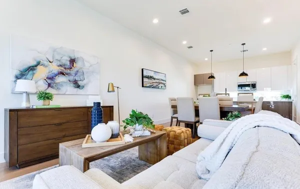 a living room with furniture fireplace and cabinet
