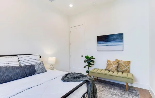 a bedroom with a bed and a couch