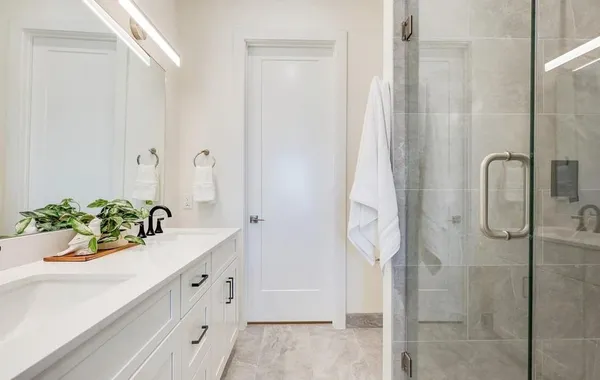 a bathroom with a sink and mirror