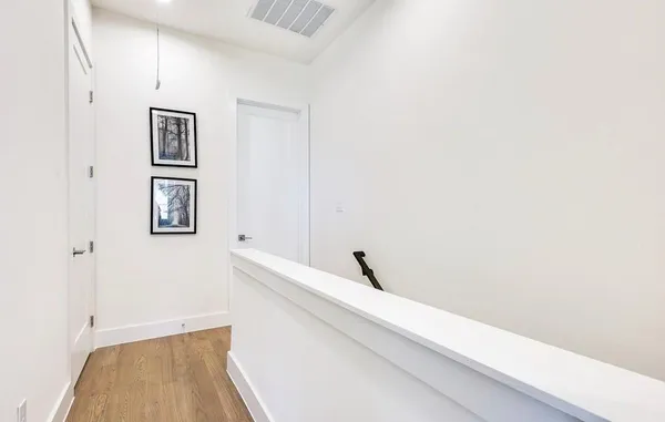 a view of a hallway with closet