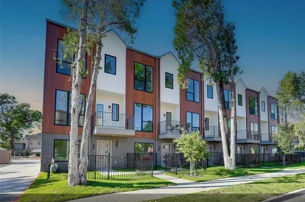 a view of a building with a yard