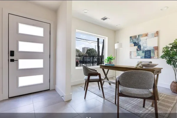a view of a livingroom with furniture and window