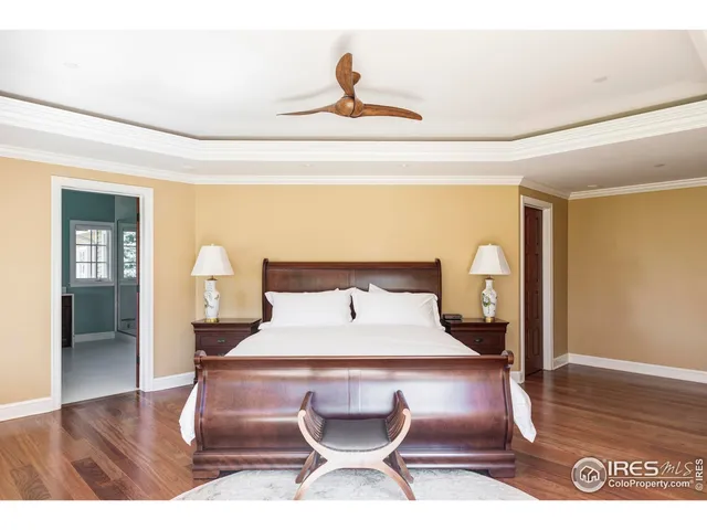 a bed sitting in a room next to a window