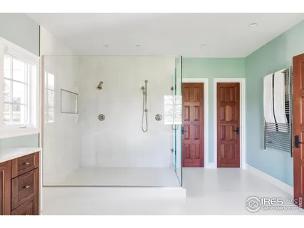 a bathroom with a glass shower door