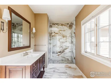 a bathroom with a sink a vanity and a mirror
