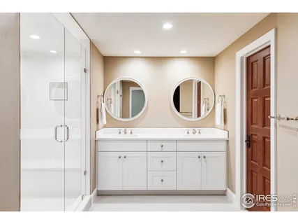 a bathroom with a mirror a sink and a mirror