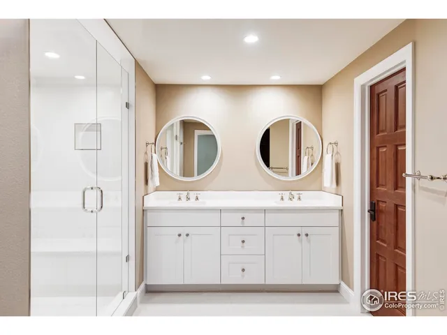 a bathroom with a mirror a sink and a mirror