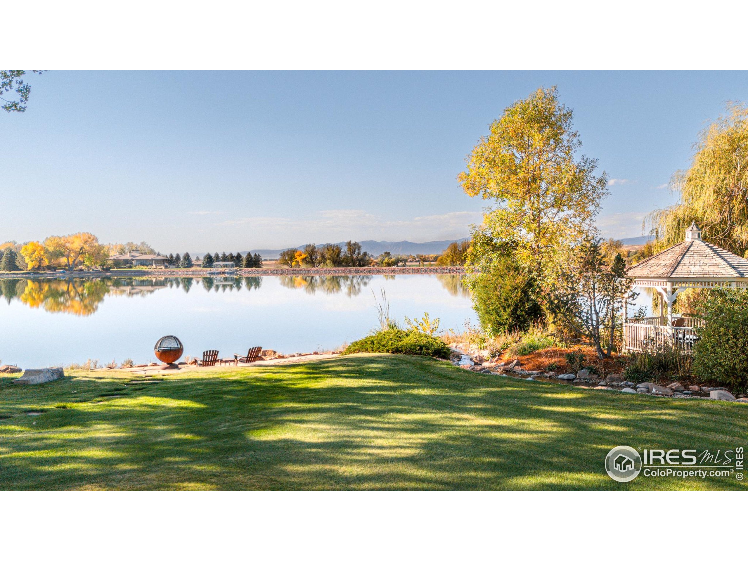 9402 Crystal Lane Longmont, CO 80503 - Photo 4 of 32 a view of a lake with a big yard