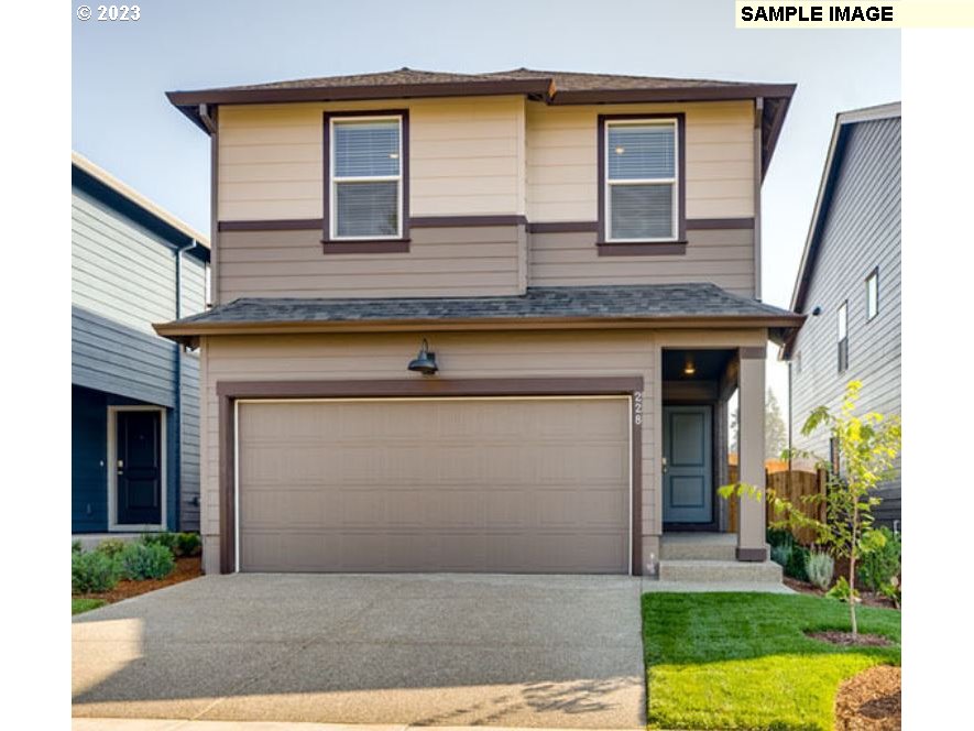 203 North Layla Place Ridgefield, WA 98642 - Photo 1 of 30 a front view of a house with garden