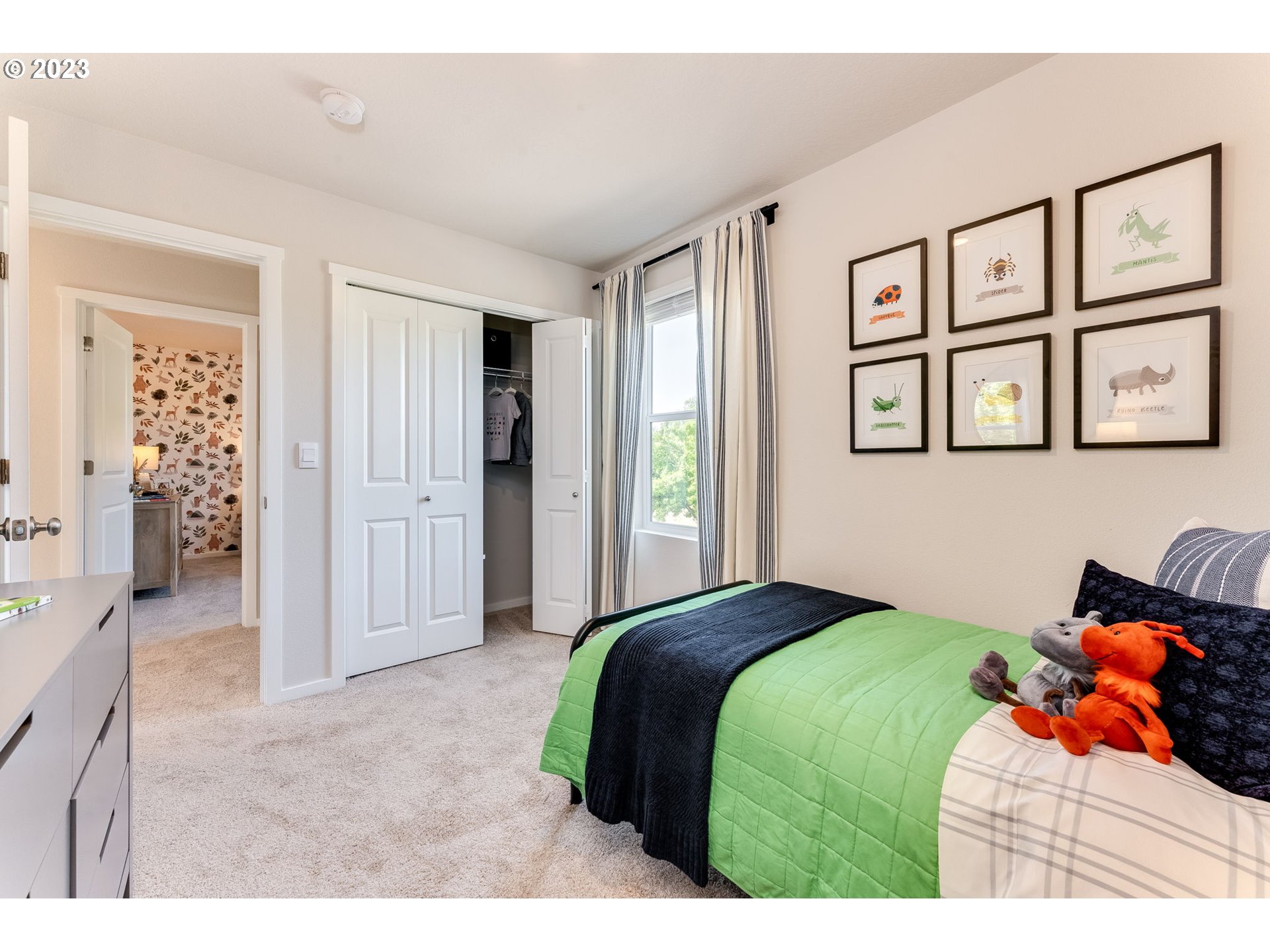 203 North Layla Place Ridgefield, WA 98642 - Photo 14 of 30 a bedroom with a bed a painting on the wall and a large window