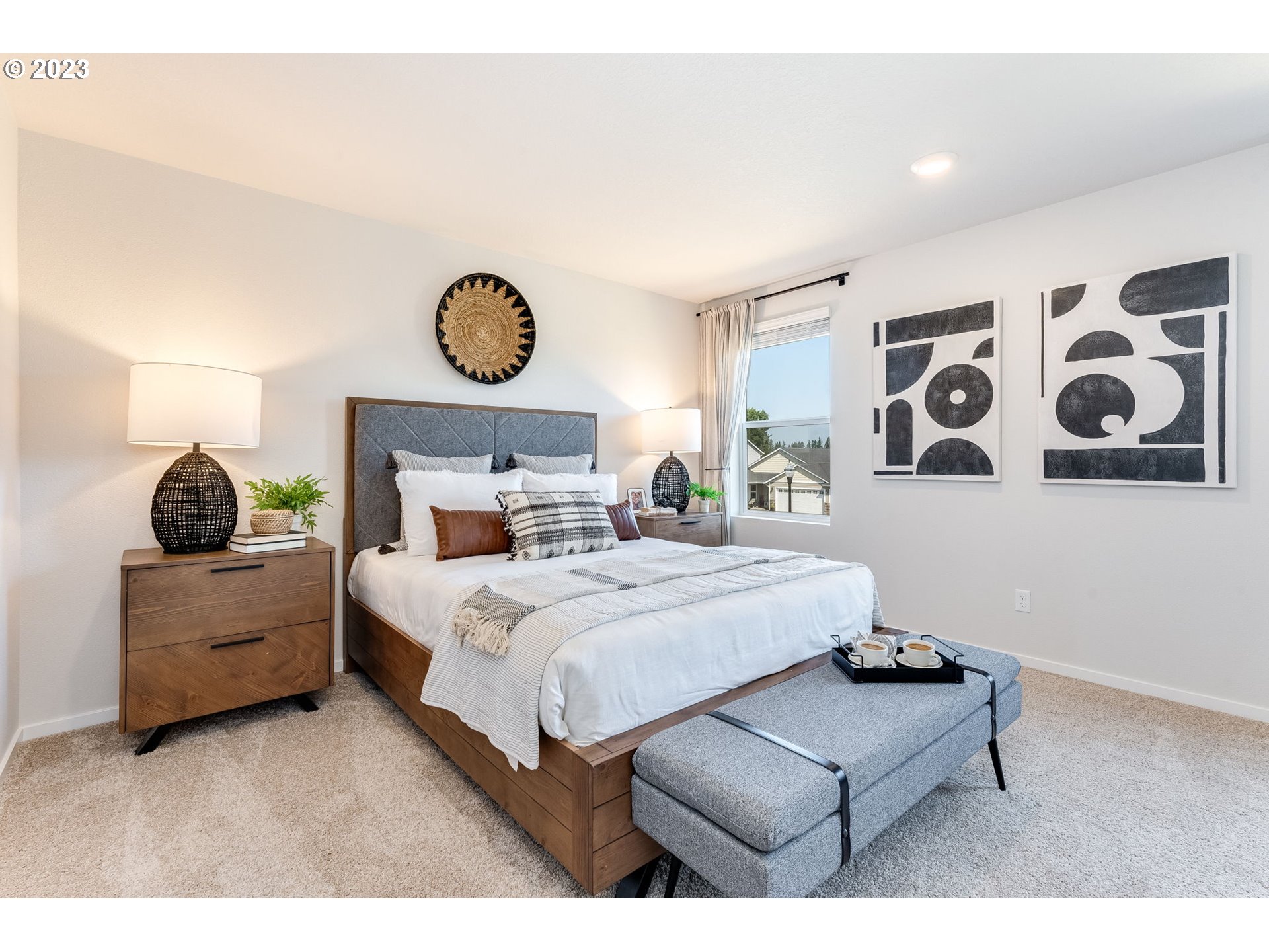 203 North Layla Place Ridgefield, WA 98642 - Photo 15 of 30 a bedroom with a bed and painting on the wall
