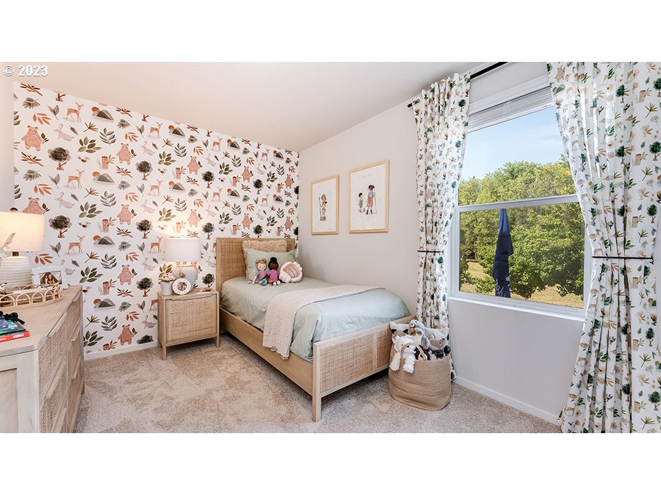 203 North Layla Place Ridgefield, WA 98642 - Photo 25 of 30 a bedroom with a bed and a window