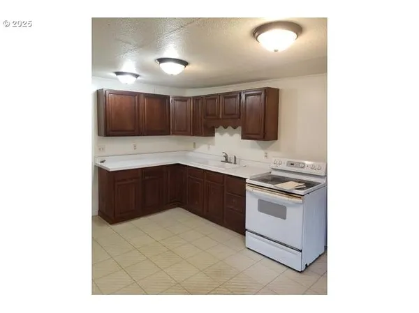 a view of cabinets and window