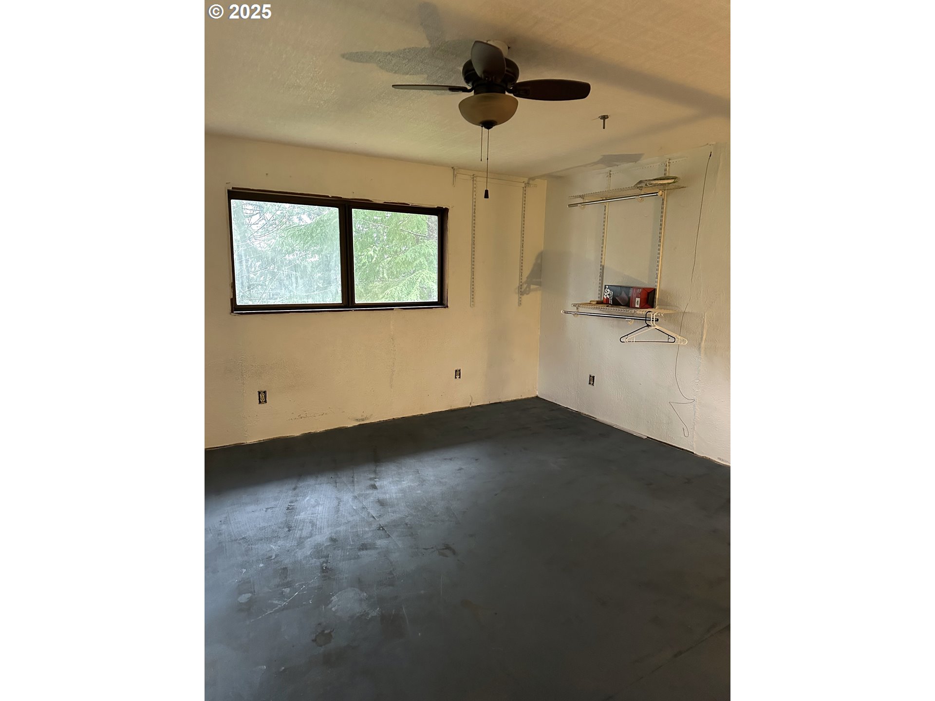 9247 Highway 126 Mapleton, OR 97453 - Photo 17 of 41 a view of an empty room with a window
