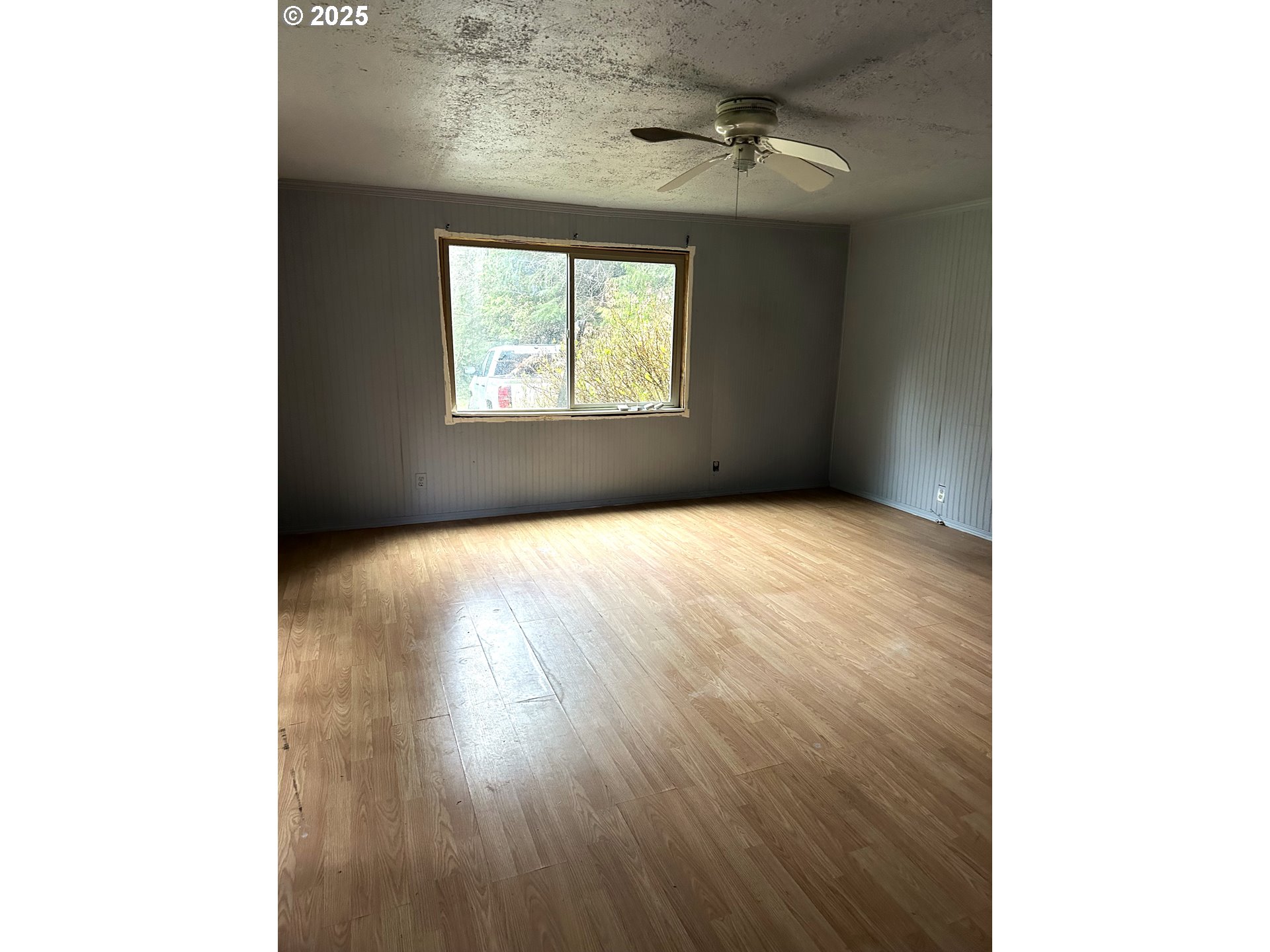 9247 Highway 126 Mapleton, OR 97453 - Photo 24 of 41 a view of an empty room with a window