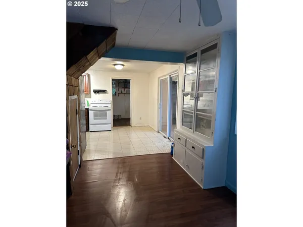 a kitchen with stainless steel appliances a refrigerator and a stove top oven