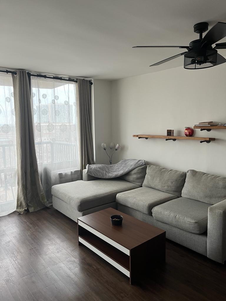 a living room with furniture and a window