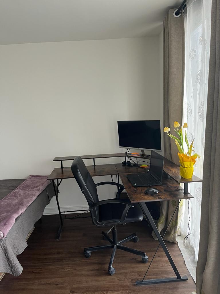 2605 South Indiana Avenue, Unit 606 Chicago, IL 60616 - Photo 2 of 34 a workspace with furniture and lamp on desk