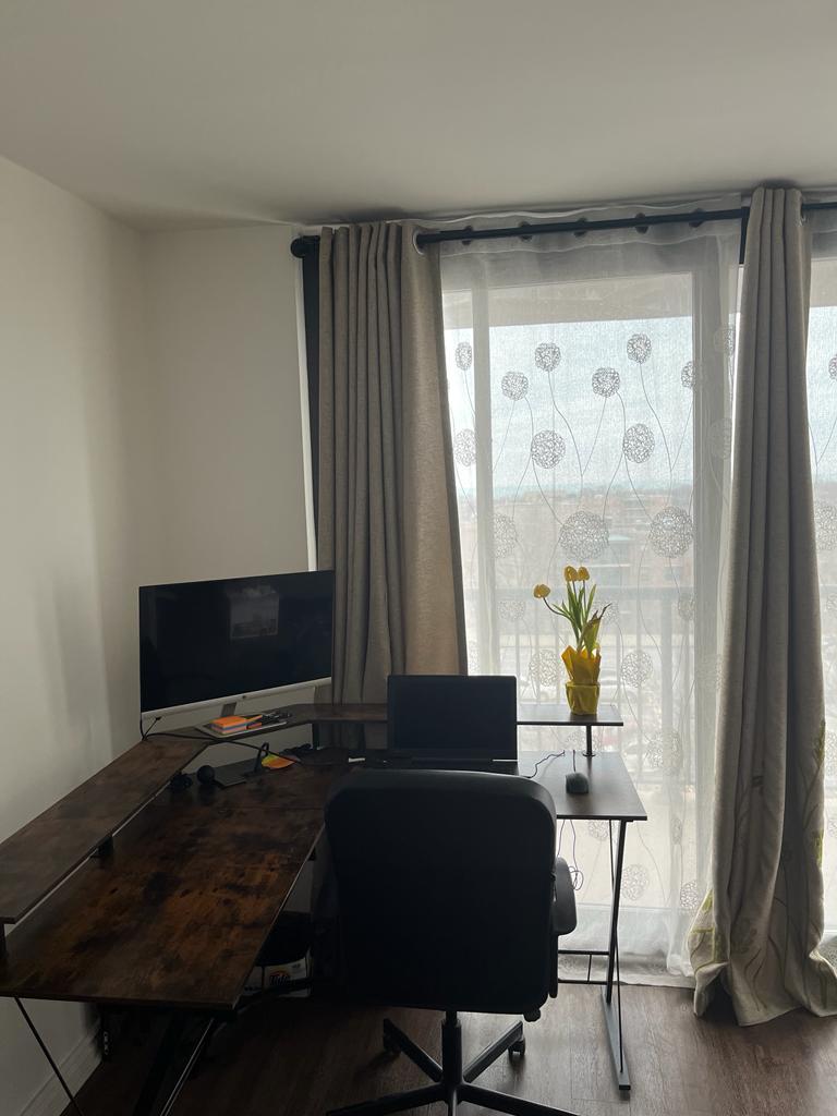 2605 South Indiana Avenue, Unit 606 Chicago, IL 60616 - Photo 3 of 34 a living room with a large window and a flat screen tv
