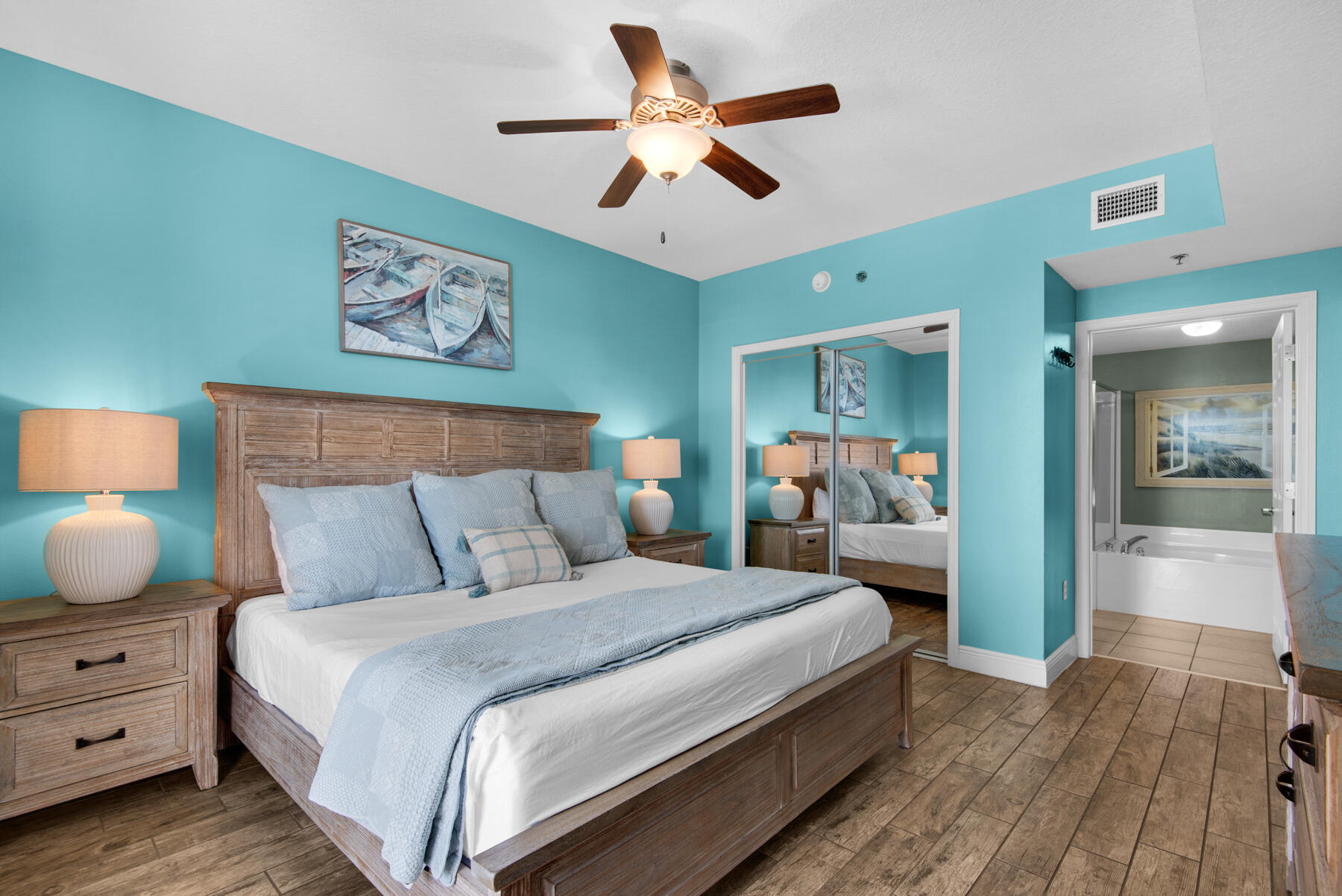 112 Seascape Drive, Unit 402 Miramar Beach, FL 32550 - Photo 13 of 31 a bedroom with bed and wooden floor