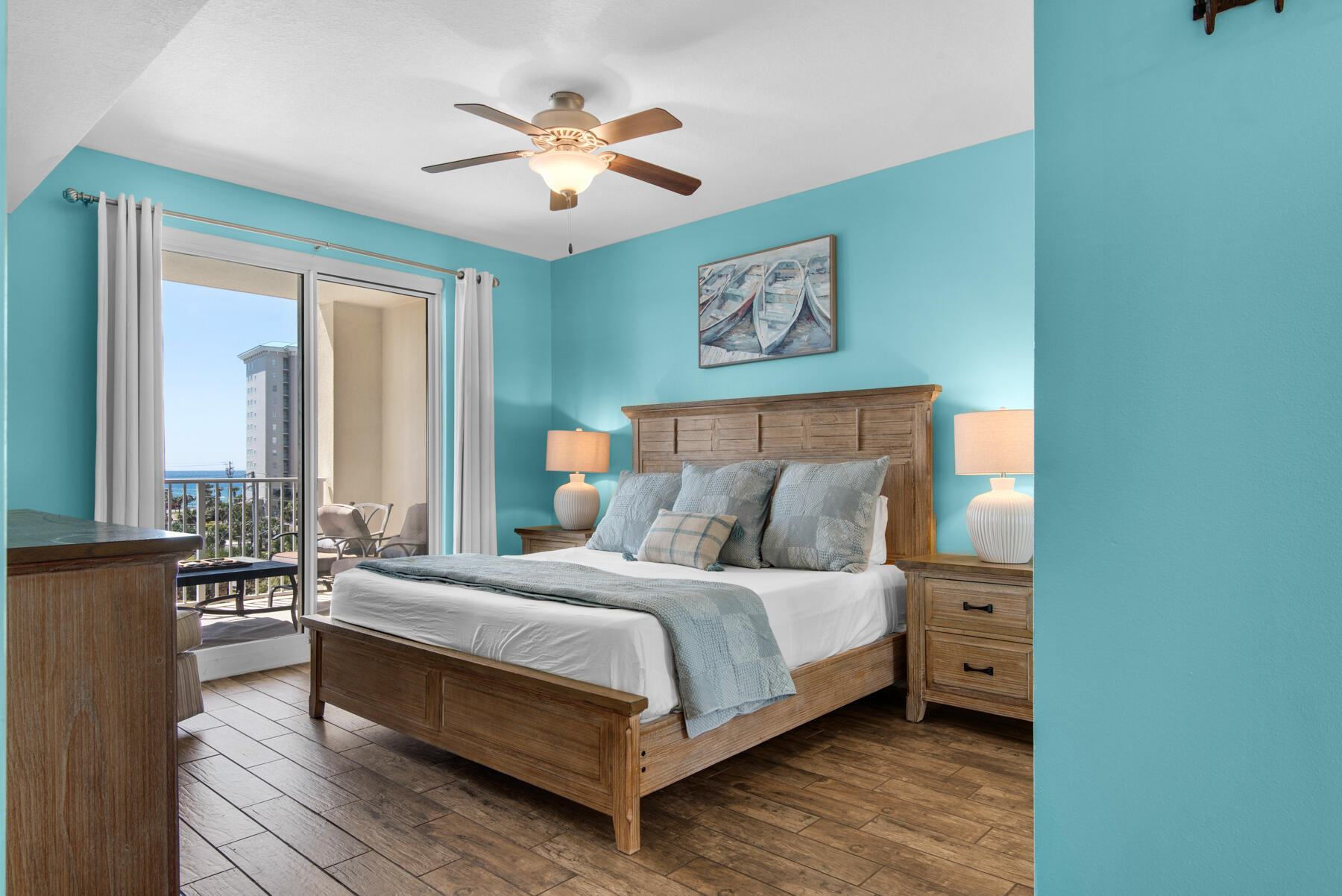 112 Seascape Drive, Unit 402 Miramar Beach, FL 32550 - Photo 14 of 31 a bedroom with a bed and a chandelier