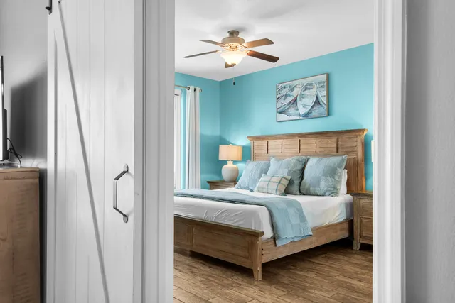 a bedroom with a bed and a chandelier