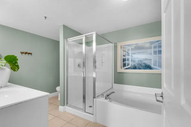 a bath room with a bathtub and a shower