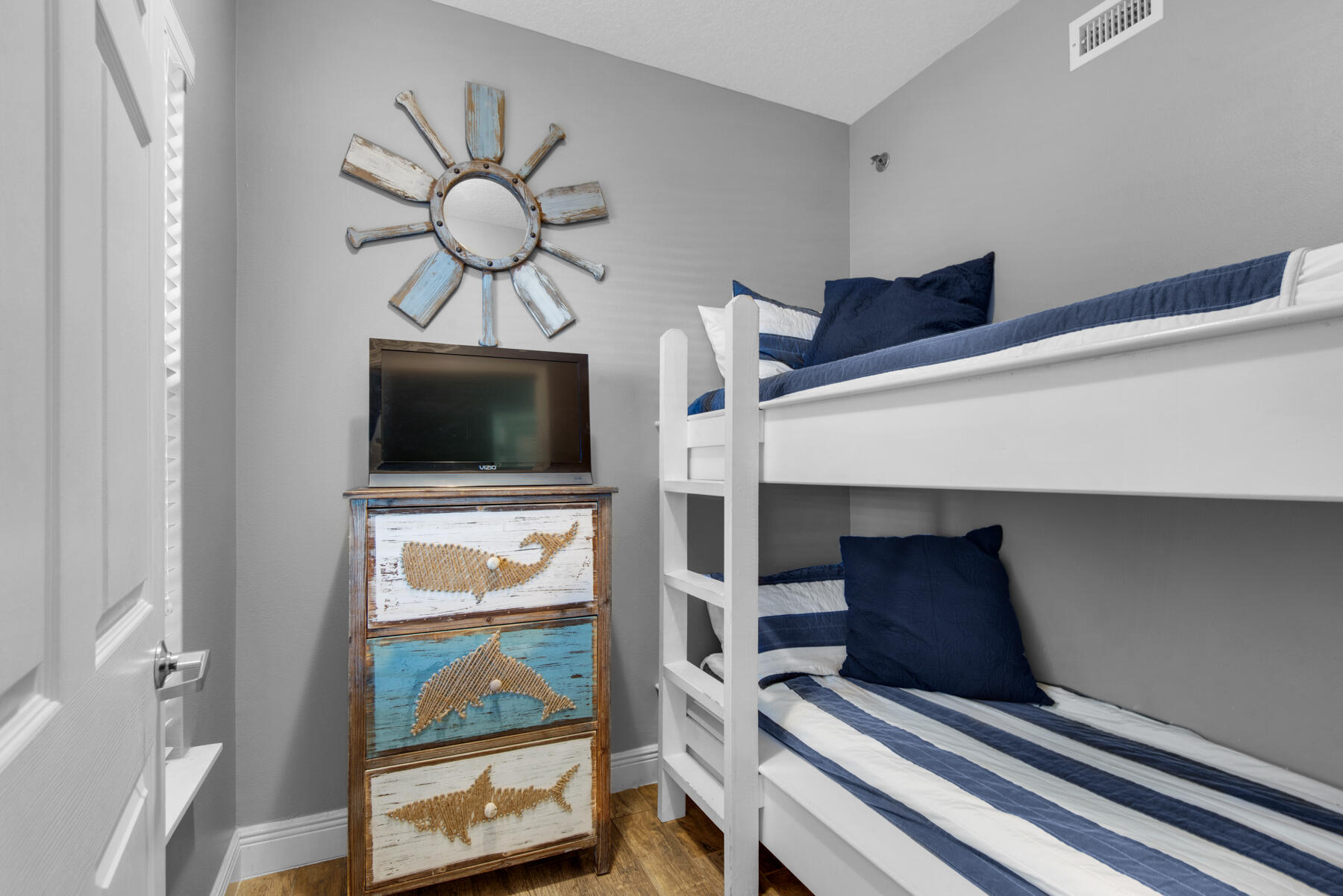 112 Seascape Drive, Unit 402 Miramar Beach, FL 32550 - Photo 19 of 31 a living room with furniture and a flat screen tv