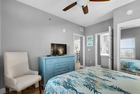 a bedroom with a bed and a television