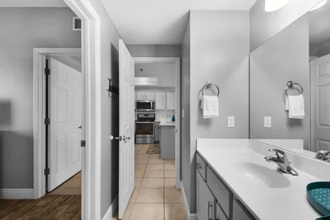 a spacious bathroom with a double vanity sink shower and a mirror