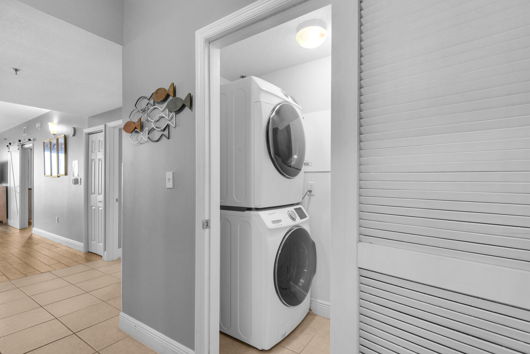 112 Seascape Drive, Unit 402 Miramar Beach, FL 32550 - Photo 25 of 31 a view of a hallway with washer and dryer