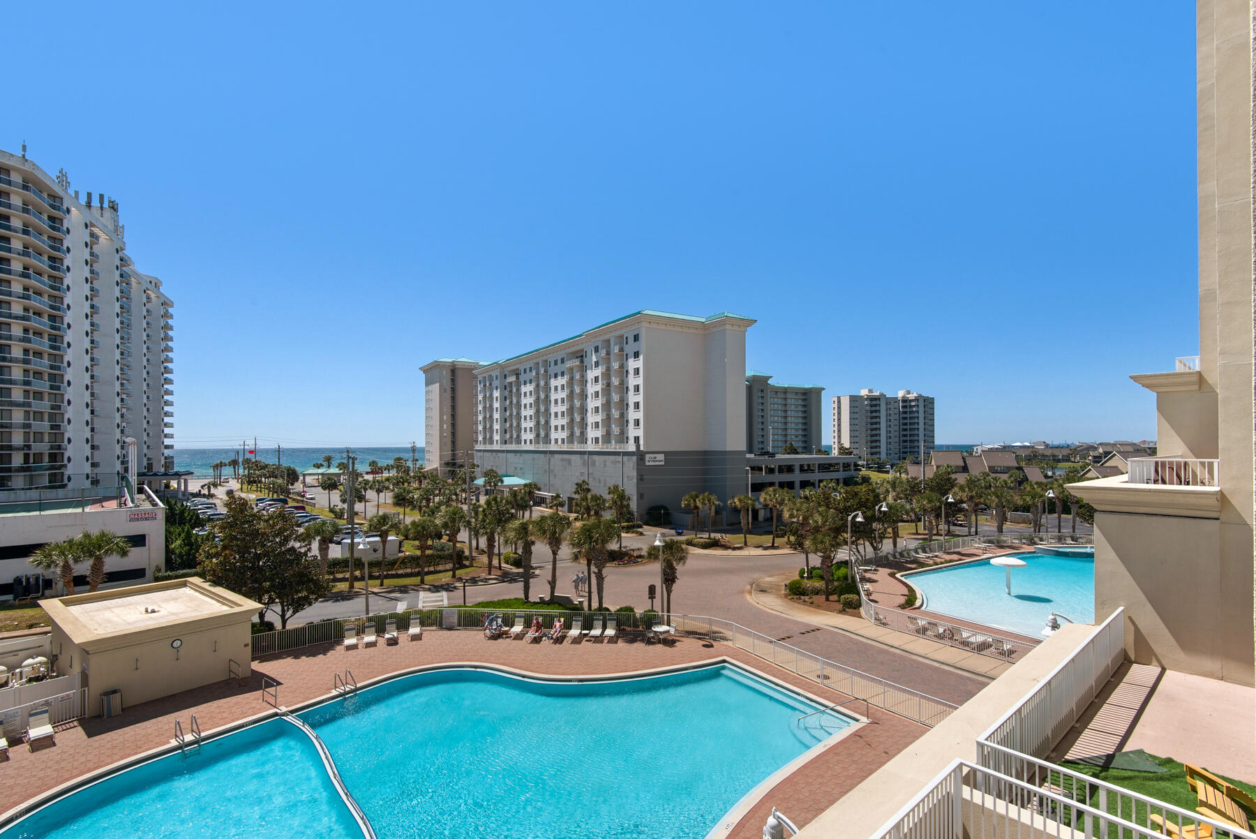 112 Seascape Drive, Unit 402 Miramar Beach, FL 32550 - Photo 30 of 31 a view of a patio with chairs and potted plants