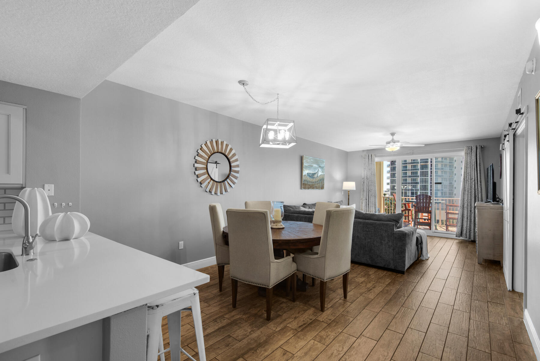 112 Seascape Drive, Unit 402 Miramar Beach, FL 32550 - Photo 7 of 31 a view of a dining room with furniture window and wooden floor