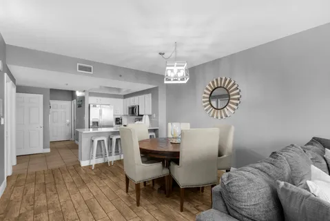 a view of a dining room with furniture and wooden floor