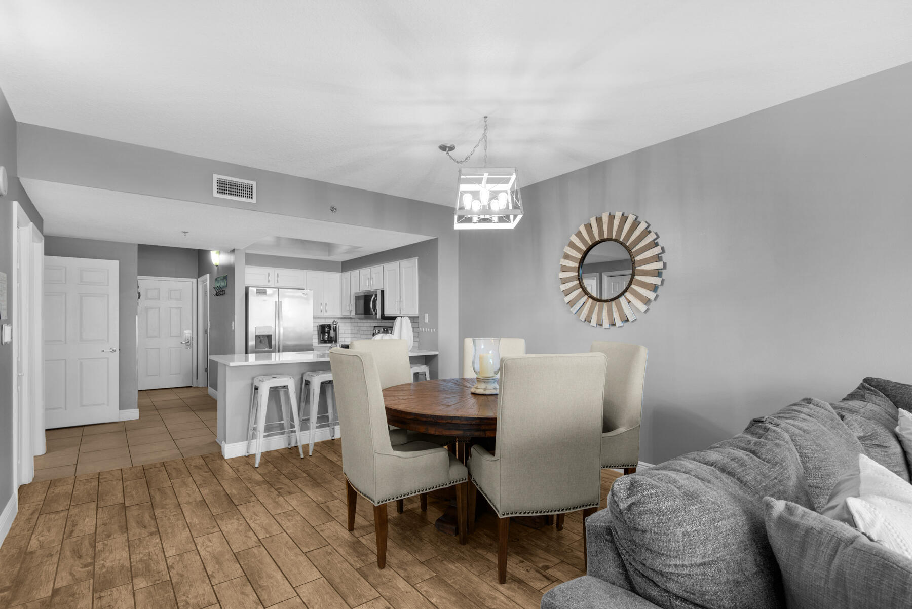 112 Seascape Drive, Unit 402 Miramar Beach, FL 32550 - Photo 8 of 31 a view of a dining room with furniture and wooden floor