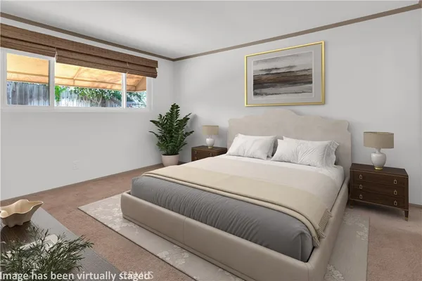 a bedroom with bed and a window