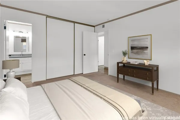 a bedroom with a bed and a table in it