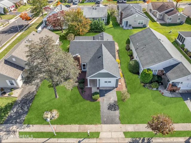 an aerial view of a house with a garden