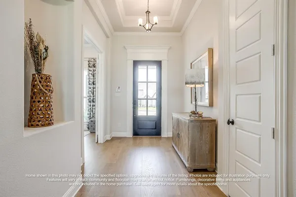 wooden floor with windows and chandelier