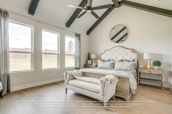 a bedroom with a bed couch and window
