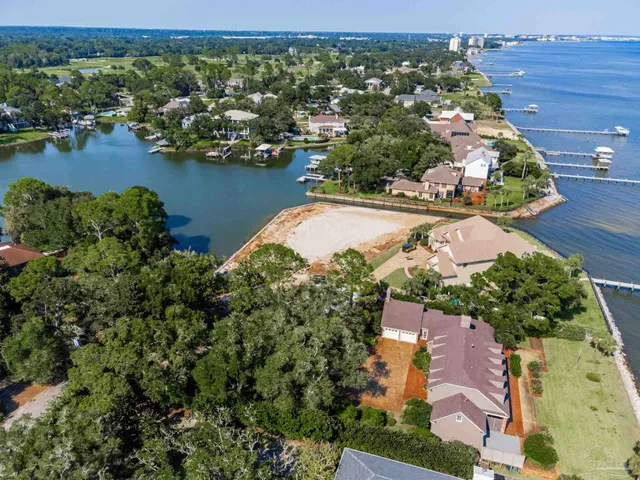 an aerial view of house with yard swimming pool and outdoor seating