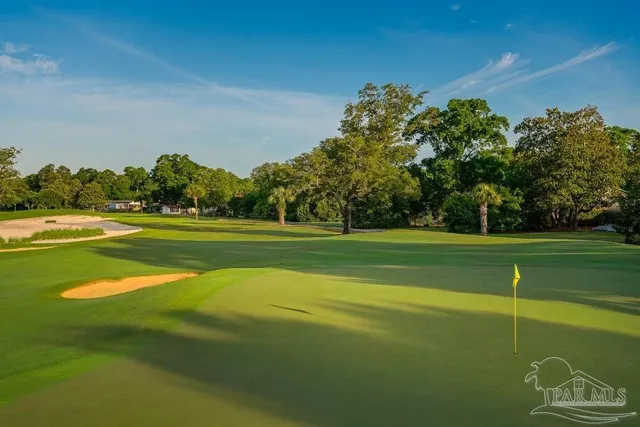 a view of a golf course with a lake
