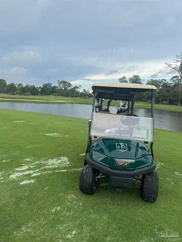a wooden bench sitting in the middle of a lake