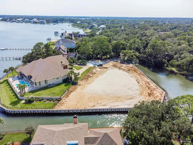 an aerial view of a house with a lake view