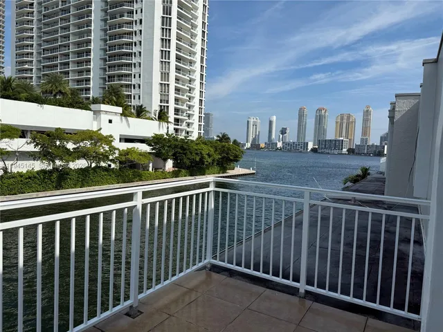 a view of a balcony with wooden floor