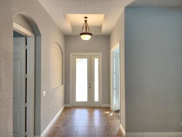 a kitchen with stainless steel appliances granite countertop counter space and chairs