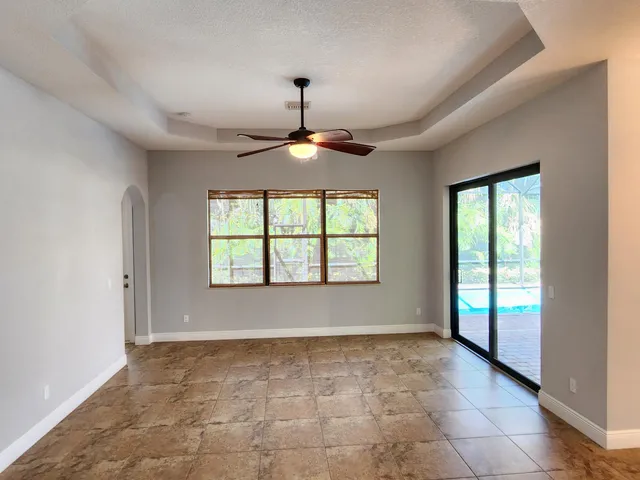 a view of a room with wooden floor door and closet