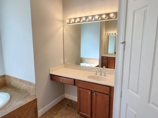 a bathroom with a sink and a shower